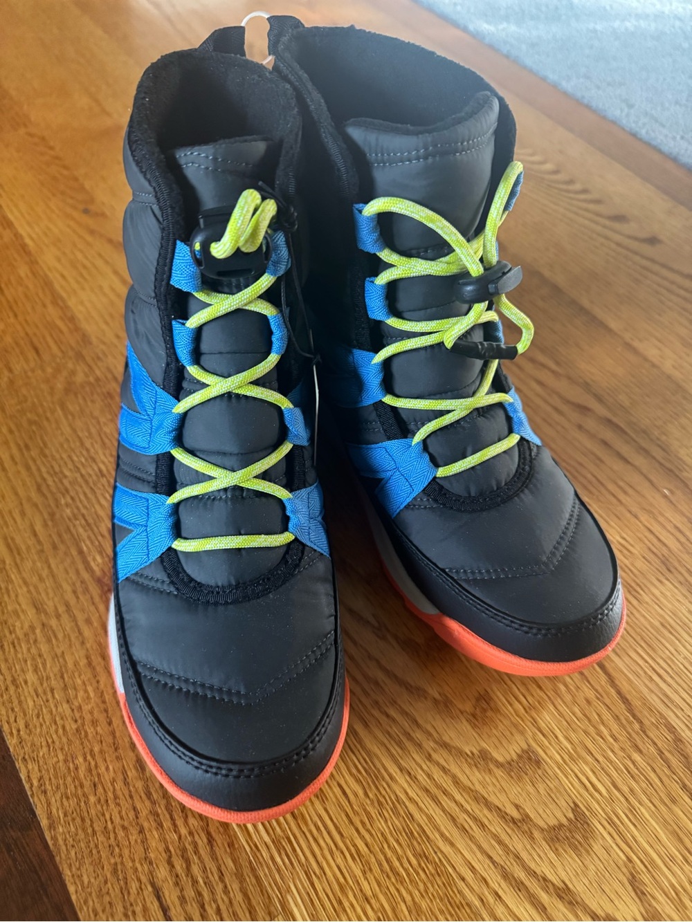 Sorel Kids Black Winter Boots with Blue Panels and Neon Yellow Laces